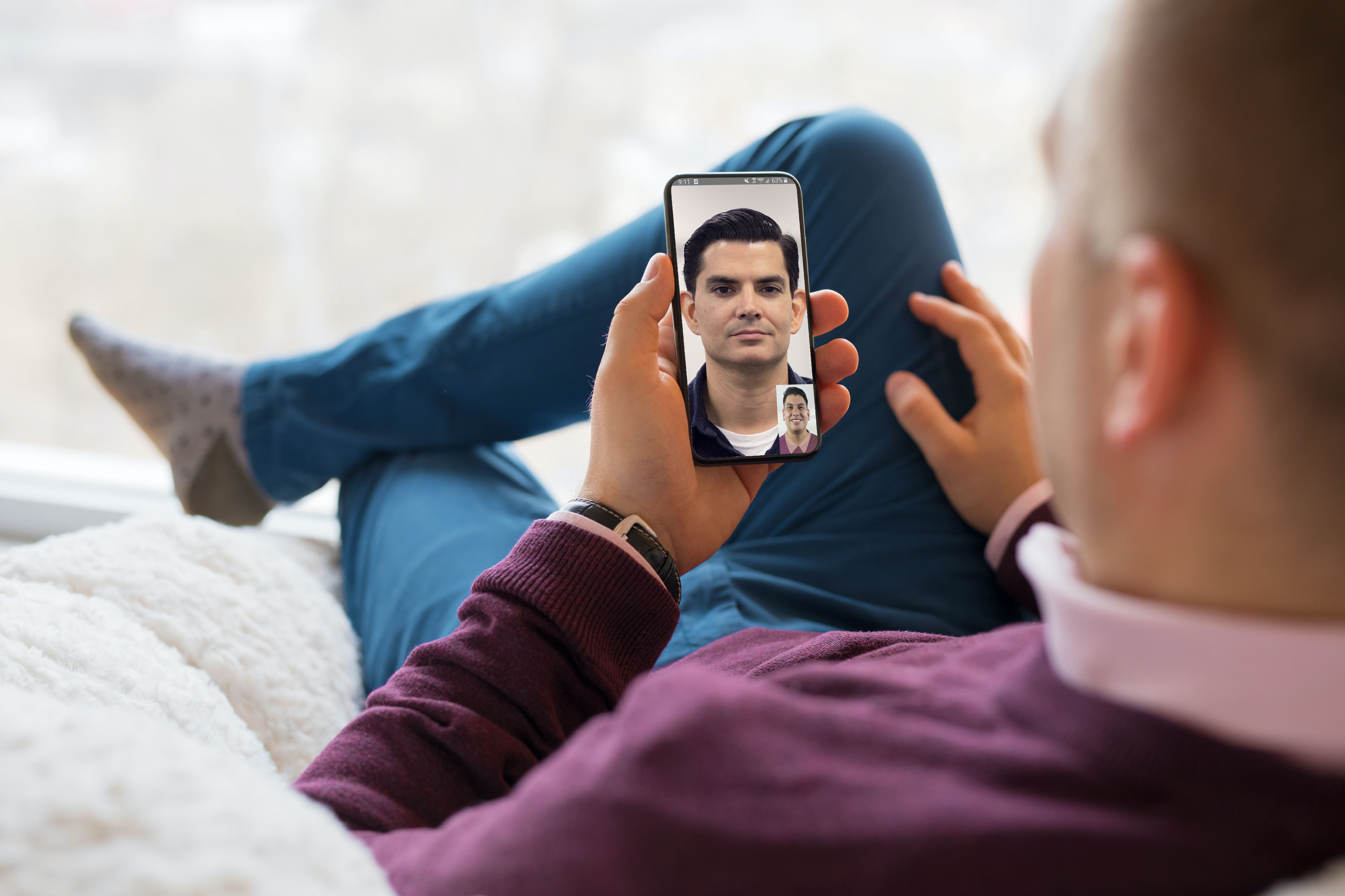 Guy On Phone Video Conference V2 Istock 1031313292